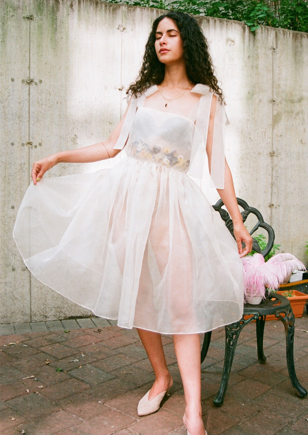 for each dress we use over fifty real flowers, pressed and sealed into custom-cut arrangements before being inserted between layers of dreamy silk organza. Exaggerated self-tie straps and universally flattering silhouette. Invisible side zip. Each one unique. Made in New York.