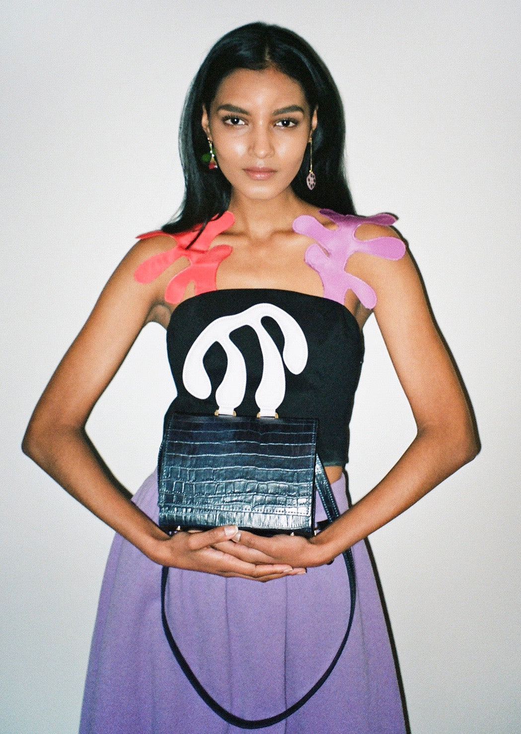 A fitted top from luxurious Italian stretch crepe, adorned with orchid and persimmon silk faille straps inspired by Matisse's paper cut-outs. Invisible separating side zip. Cropped fit.