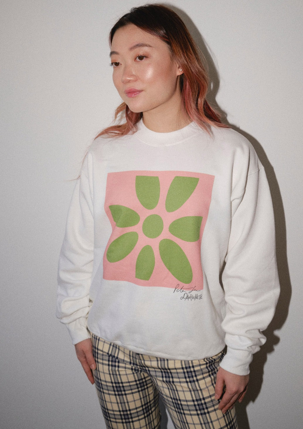 White pullover with Peter Gee's iconic pink and green flower screen print
