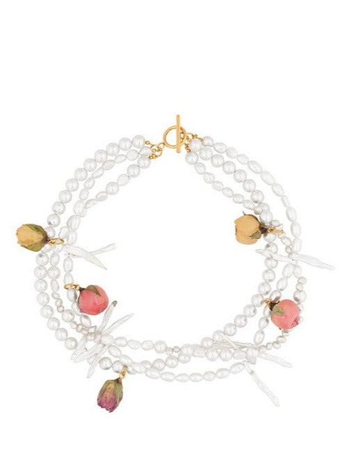 Tripled stranded freshwater and glass pearl necklace with mixed preserved rosebuds and gold clasp.