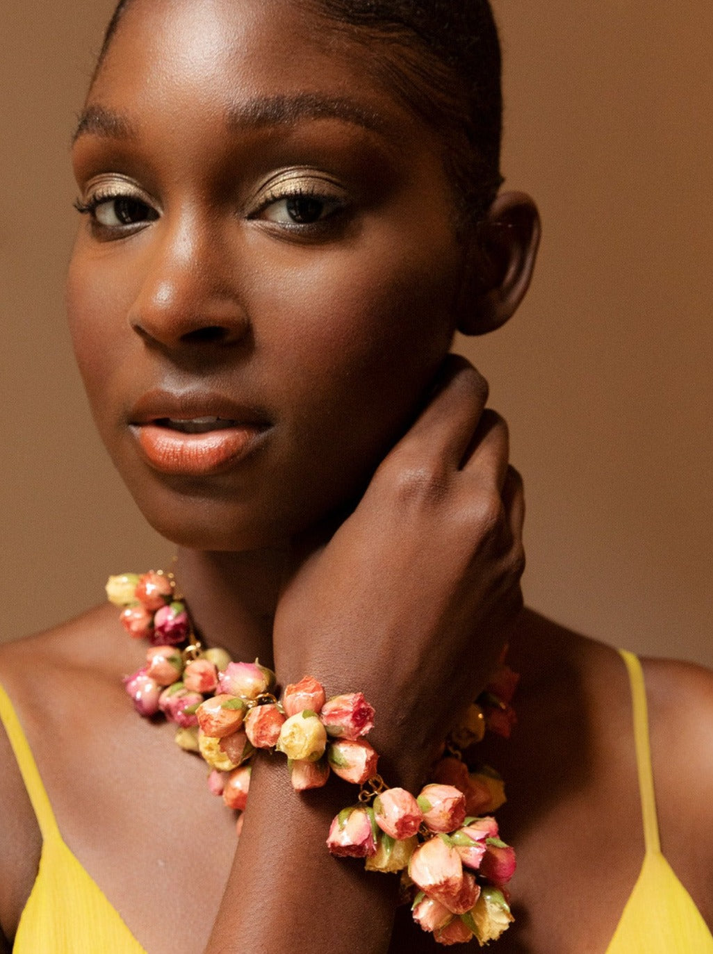 Over two dozen roses, suspended from a gold-plated stainless steel Albert chain.