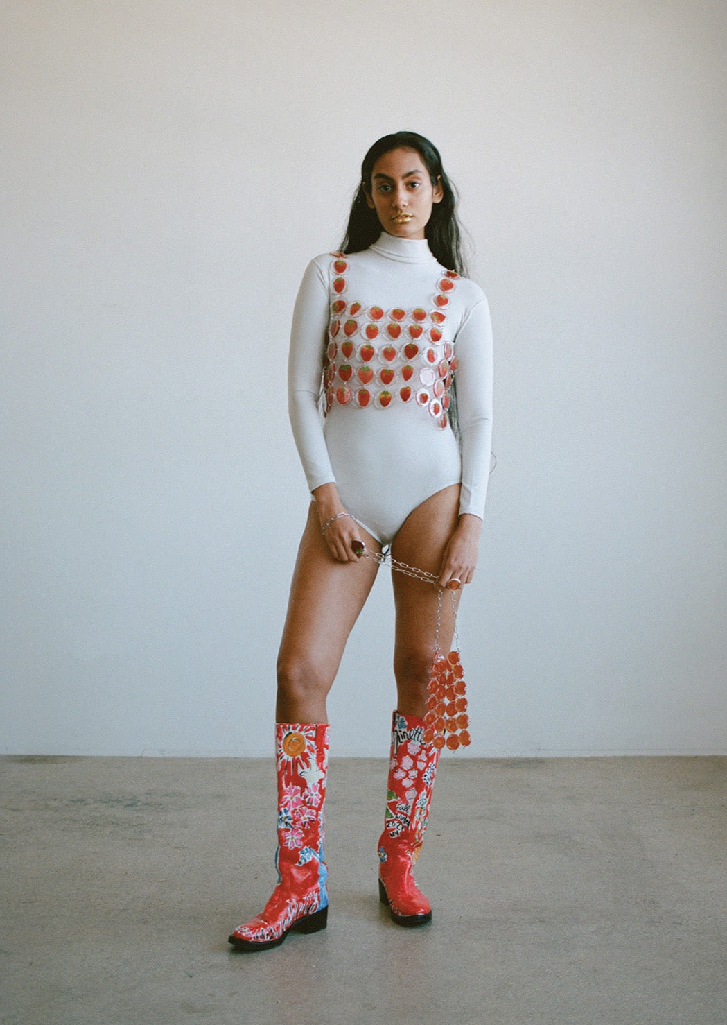 Our chainmaille is a distinctive technique where hundreds of preserved botanicals are intricately assembled-- this top is crafted from real strawberries. Relaxed fit, antiqued silver toggle side closure for easy on/off.