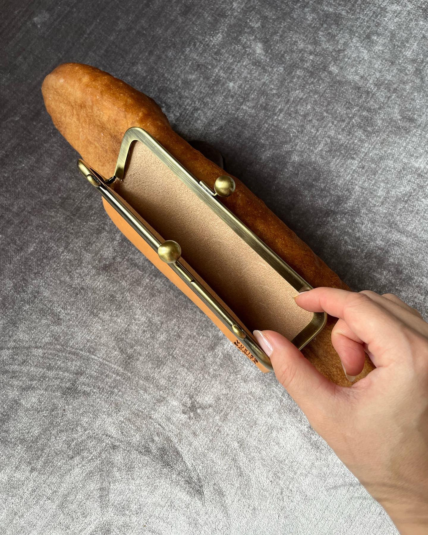 Baguette bag! Crafted from real, surplus bread-- baked, hollowed, and reimagined into a delightful bag in Japan. Coated in an anti-bacterial and anti-fungal, eco-friendly resin.