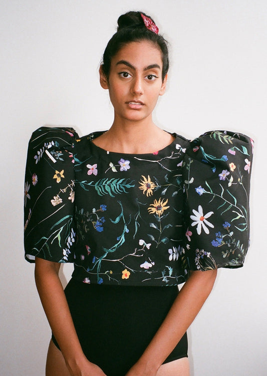 Cropped shirt with bateau neckline and voluminous mid-length bishop sleeves. Slips on. Constructed from smooth deadstock twill printed with our Scrapbook Floral print.