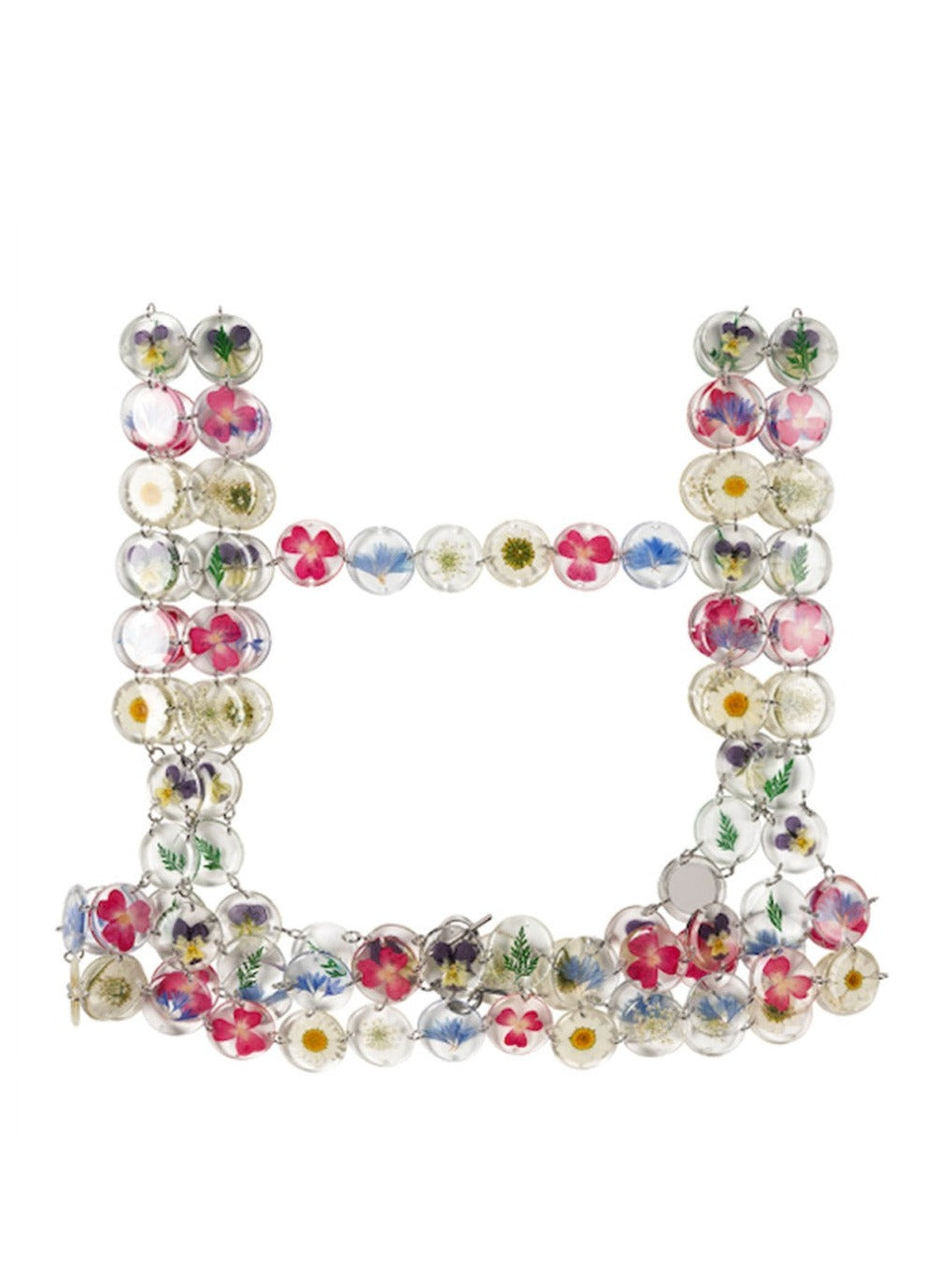 Chainmaille harness made of assorted flowers preserved in round resin charms connected by silver jump rings.