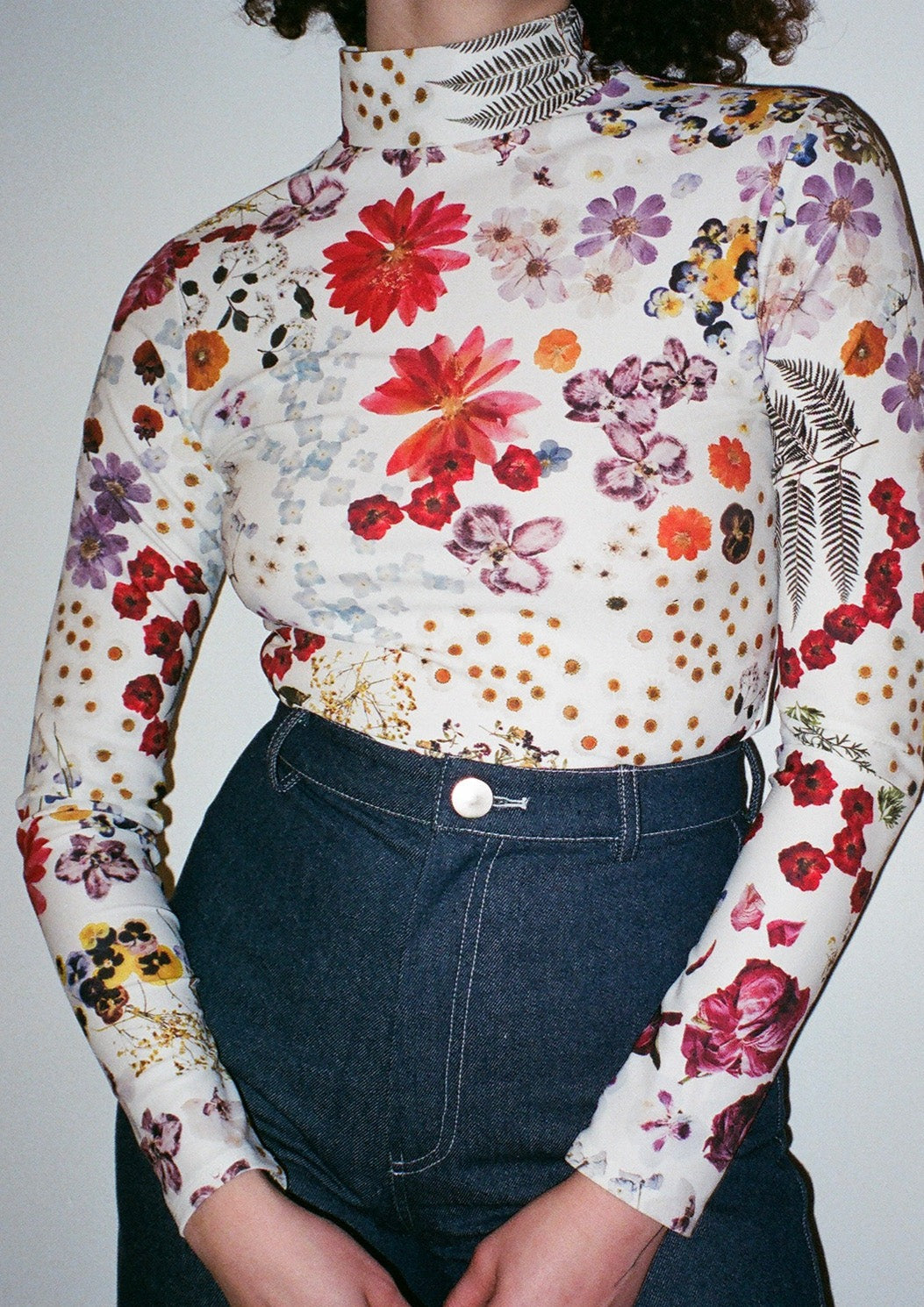 Perfect french-cut turtleneck in our Potpourri print, featuring scanned florals from our NYC studio. Made from a recycled polyester blend that is both anti-bacterial and water-resistant-- meaning this top can also be worn as a swim top or rash guard.