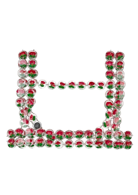 Chainmaille harness made of red roses preserved in round resin charms connected by silver jump rings.