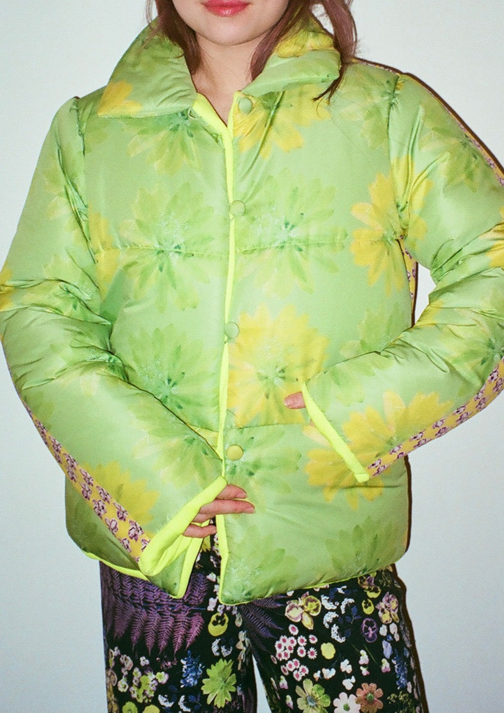 The world's most joyful, coziest puffer in neon orchid and neon lotus recycled polyester.  The flowers for these prints were grown and pressed by designer Olivia Cheng's mother.