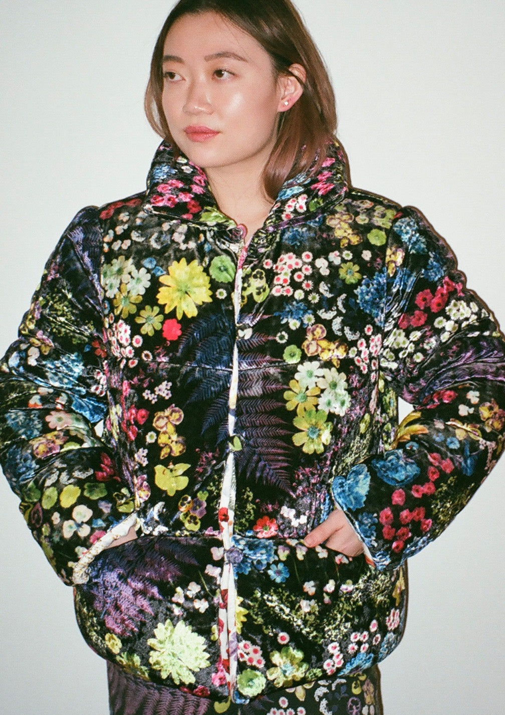 Velvet puffer jacket in multicolored Acid Potpourri print with black base color.