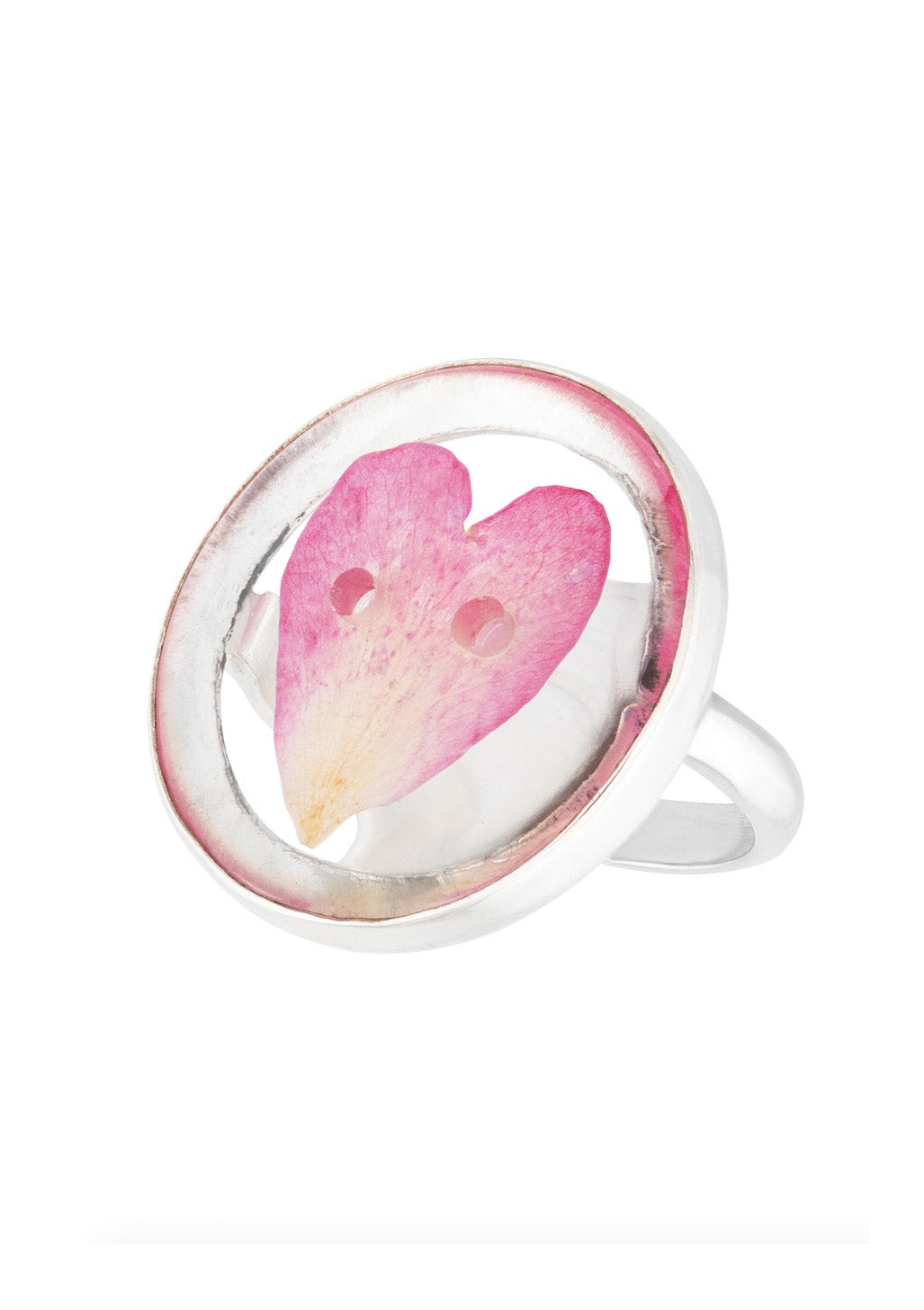 Rose petal preserved in round button shaped ring on silver ring band.