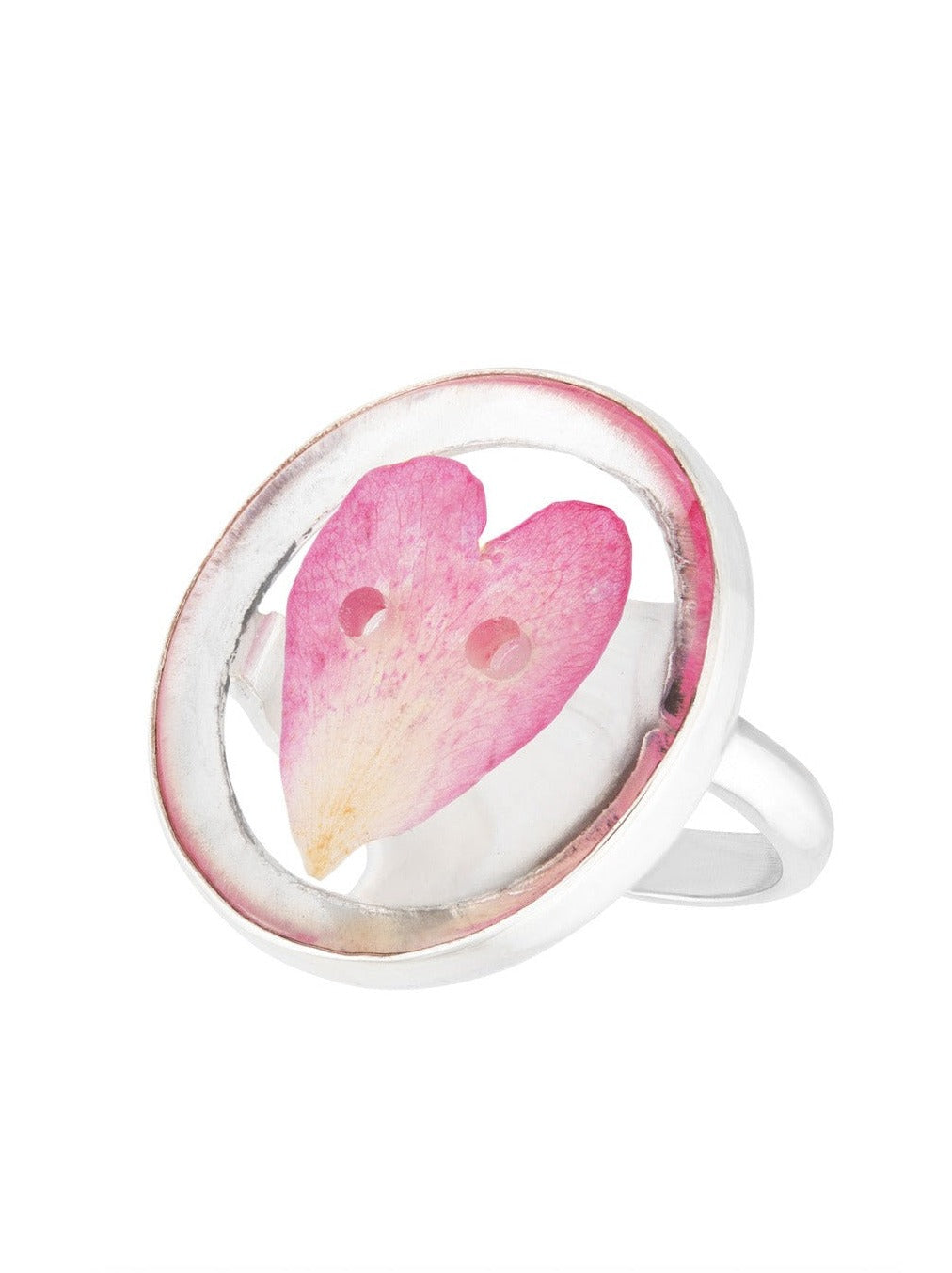 Rose petal preserved in round button shaped ring on silver ring band.