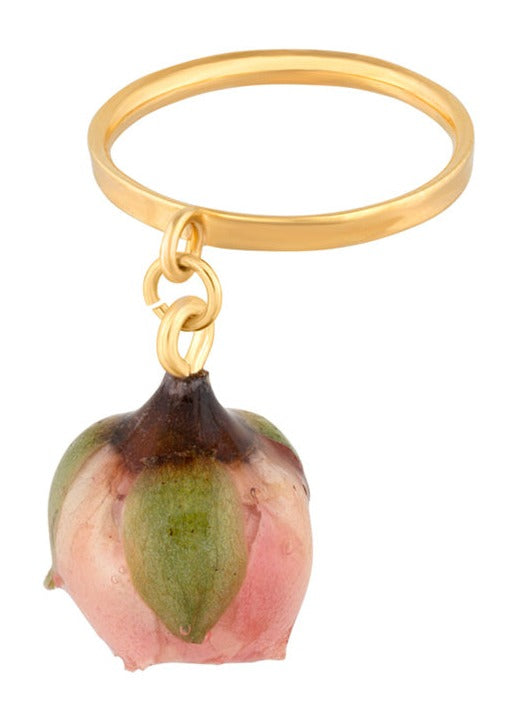 Mini sakura rose charm pendant suspended from gold ring.