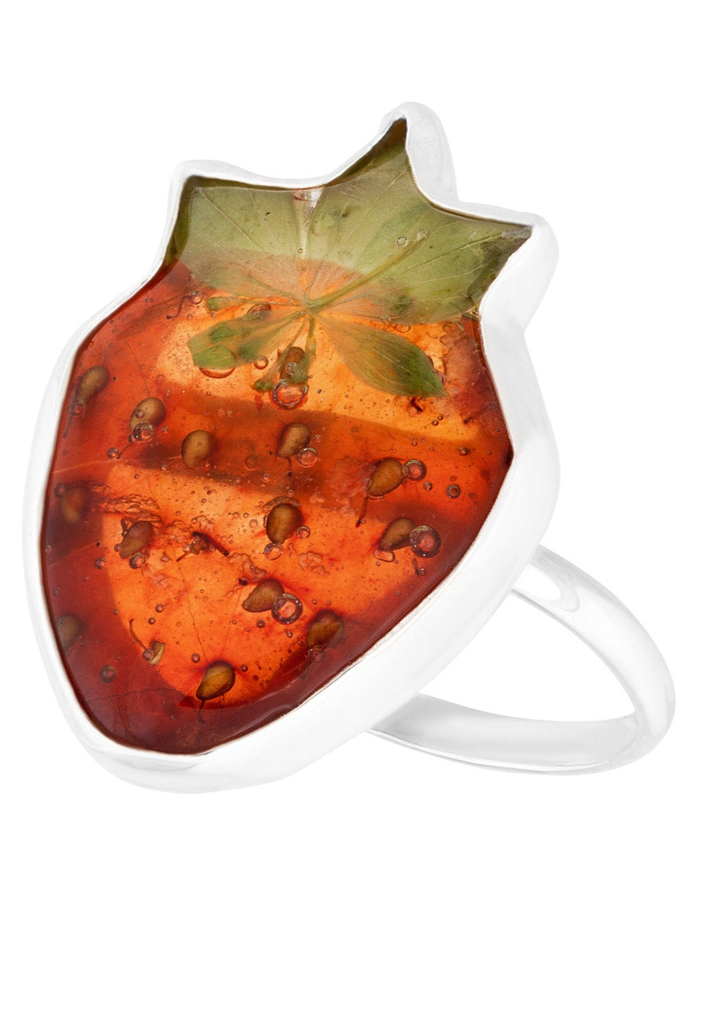 Whole strawberry preserved in resin on silver ring band.