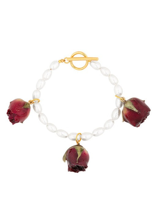 Ivory rice pearl bracelet with triptych of vampire rosebuds.