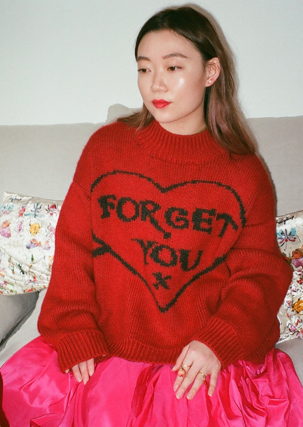 Scarlet red mock mock neck sweater with signature jacquarded "Forget You" heart motif.