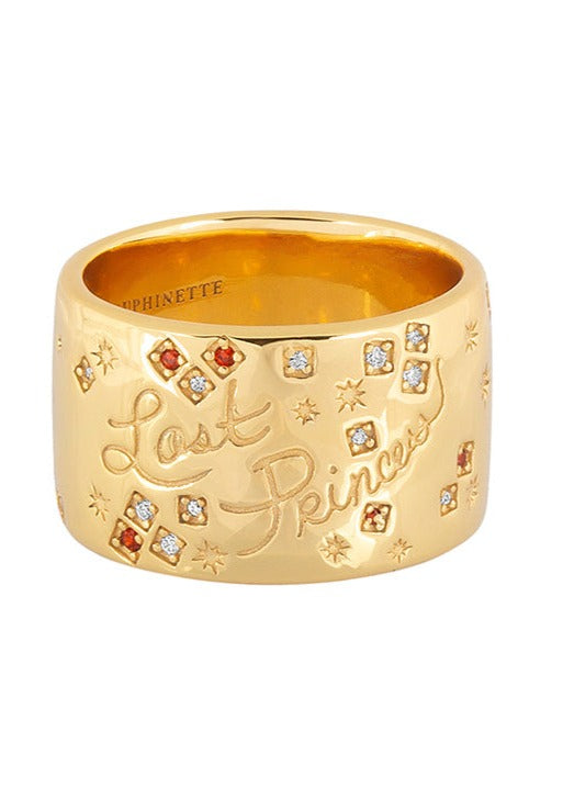 Gold cigar band with inscribed handwritten "Lost Princess" script and is inset with a constellation of sparkling rubies and CZ stones.