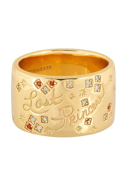 Gold cigar band with inscribed handwritten "Lost Princess" script and is inset with a constellation of sparkling rubies and CZ stones.