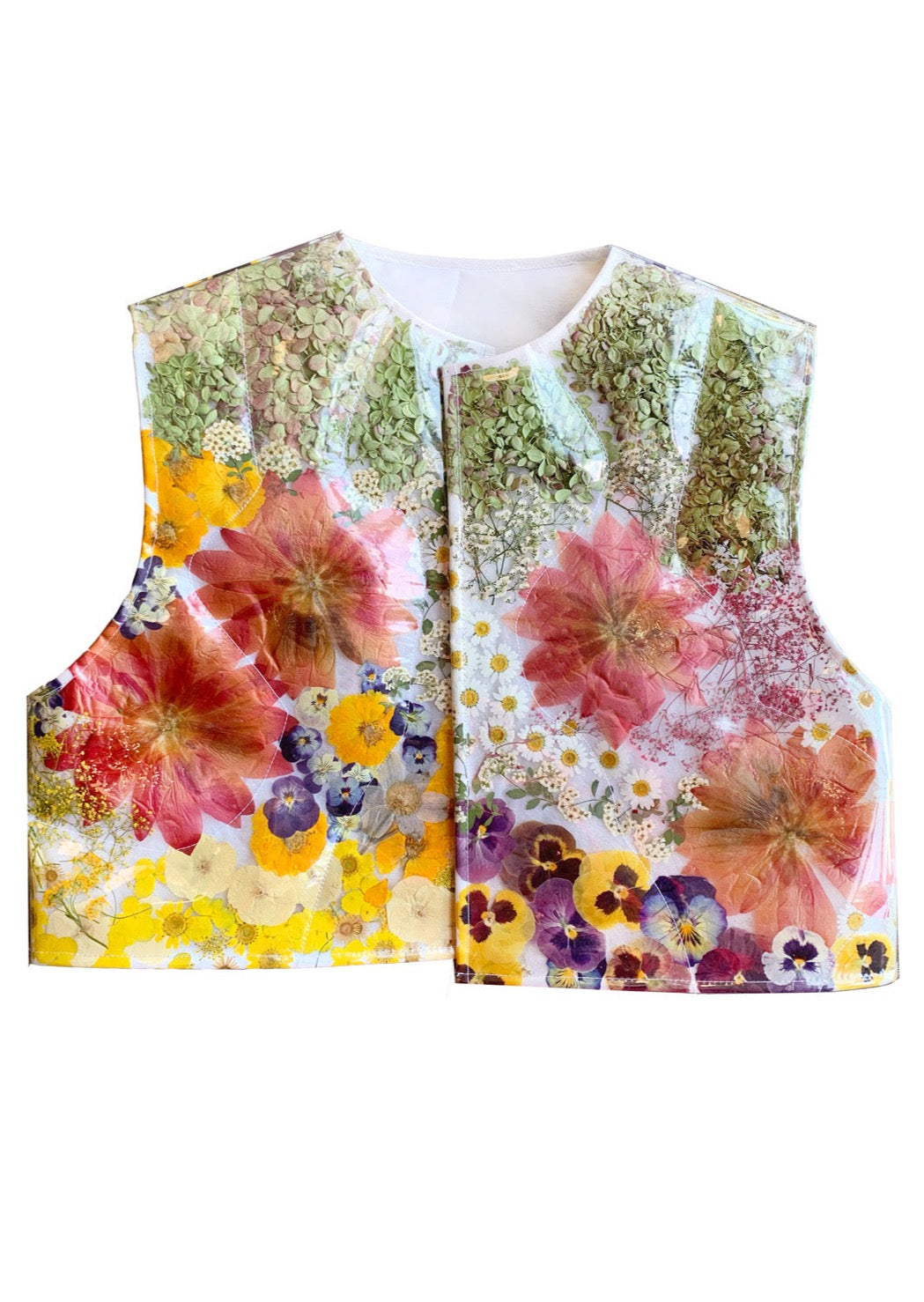 Puffer vest filled with approximately 1,000 real flowers-- everything from peonies to hydrangeas to pansies. Each vest features a custom floral arrangement by designer Olivia Cheng, and is made-to-order at our New York City studio