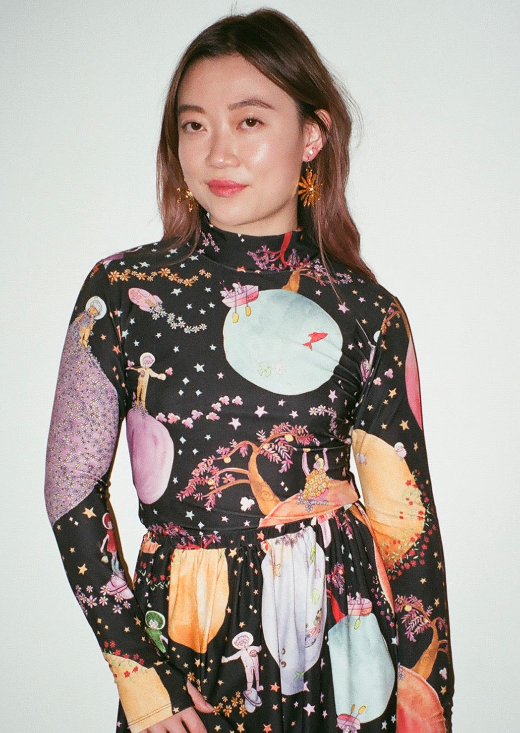 Our signature body-hugging turtleneck. Printed in our intergalactically delightful Good Girls go to Mars print, a multi-planet celebration of joy in the high skies.