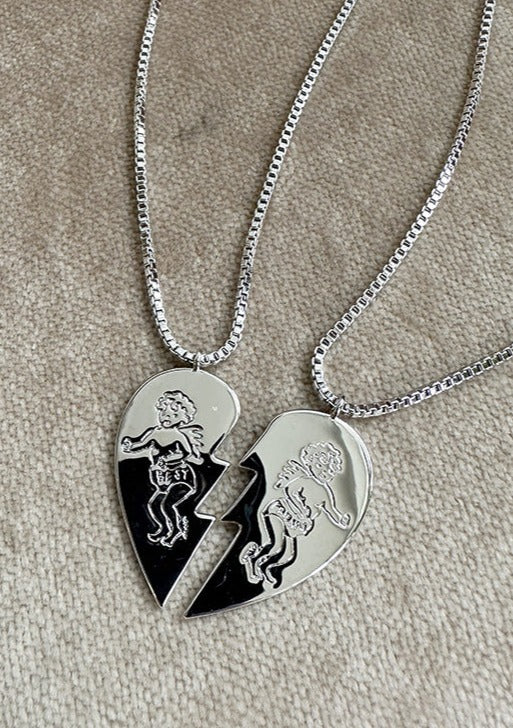 Silver Happy Hearts Necklace Pair with the cherubs on each heart half on thin silver chain.