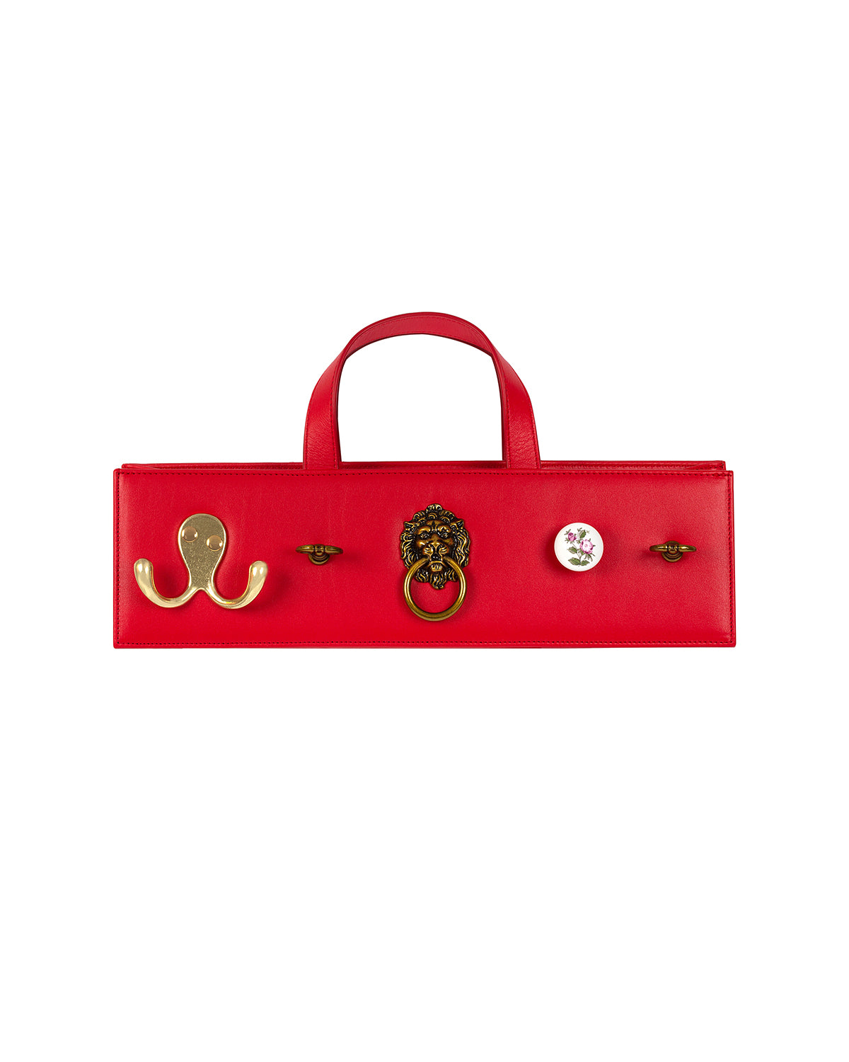 Rectangular cherry red leather bag with five assorted metal and ceramic hardware embellishments. 