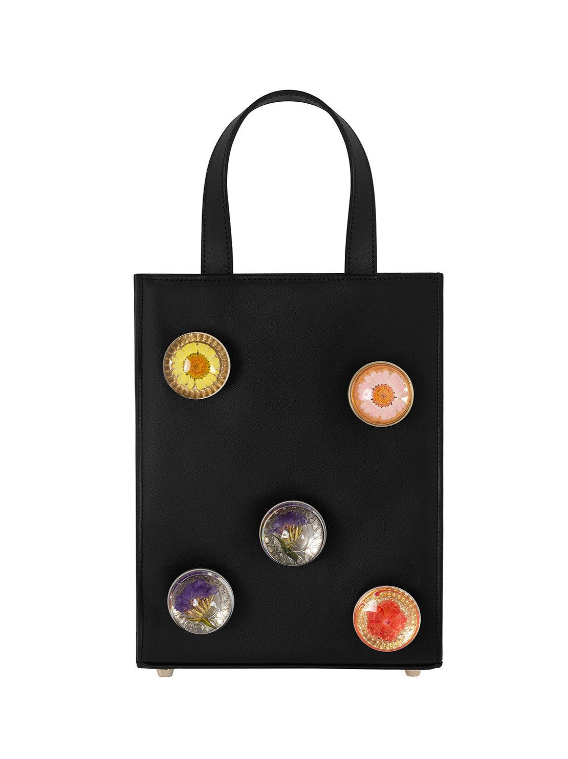 Black leather bag with 5 assorted preserved  floral knobs.