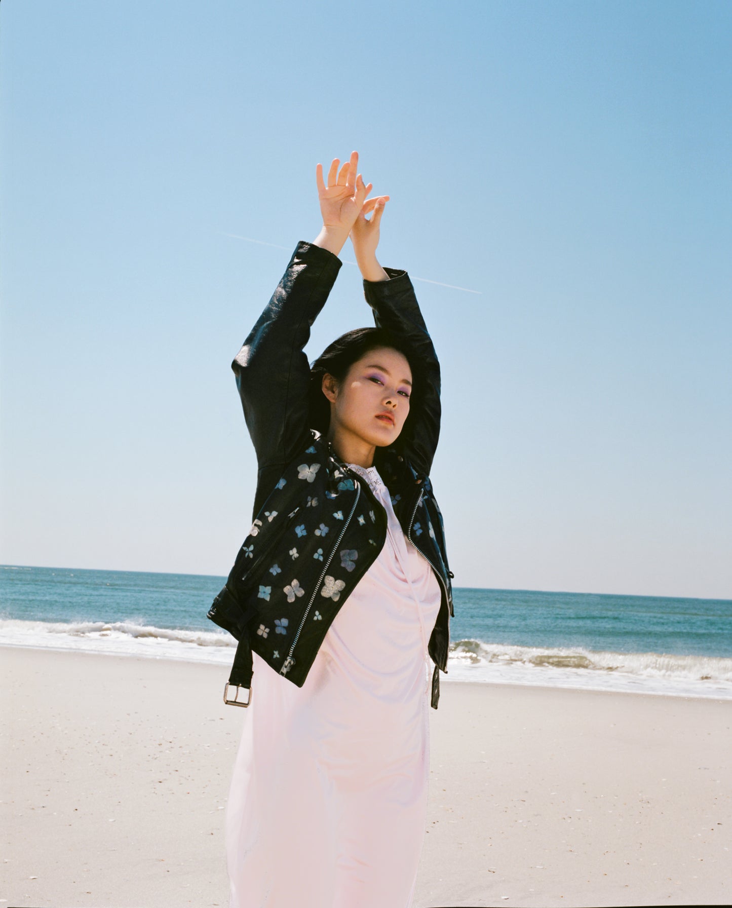 Inspired by the sidewalk gardens lining New York City each spring. This is a vintage black leather jacket coated in white paint, delicately adorned with real pressed flowers.