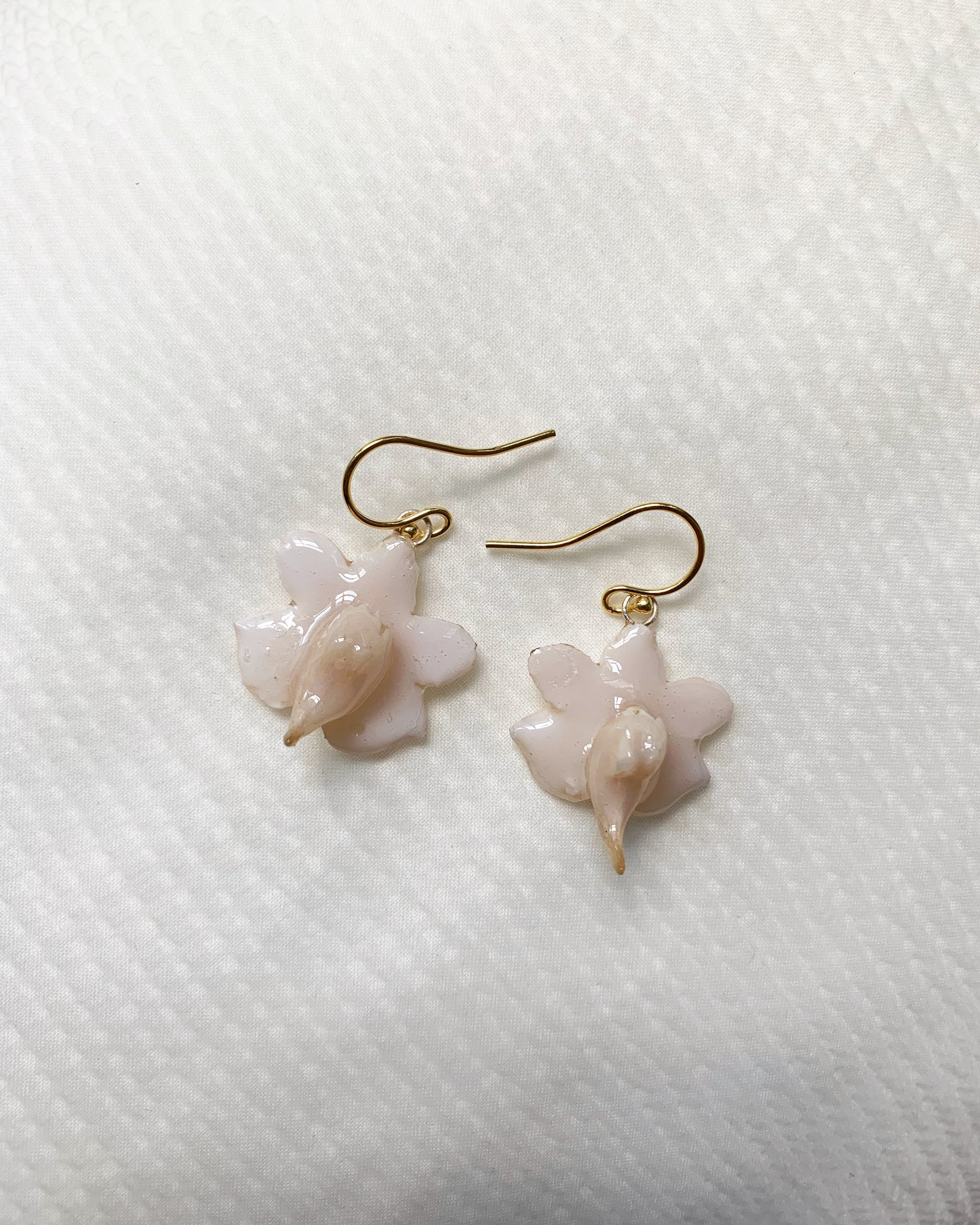 Resin Coated White Vanille Orchid On French Hook Earrings