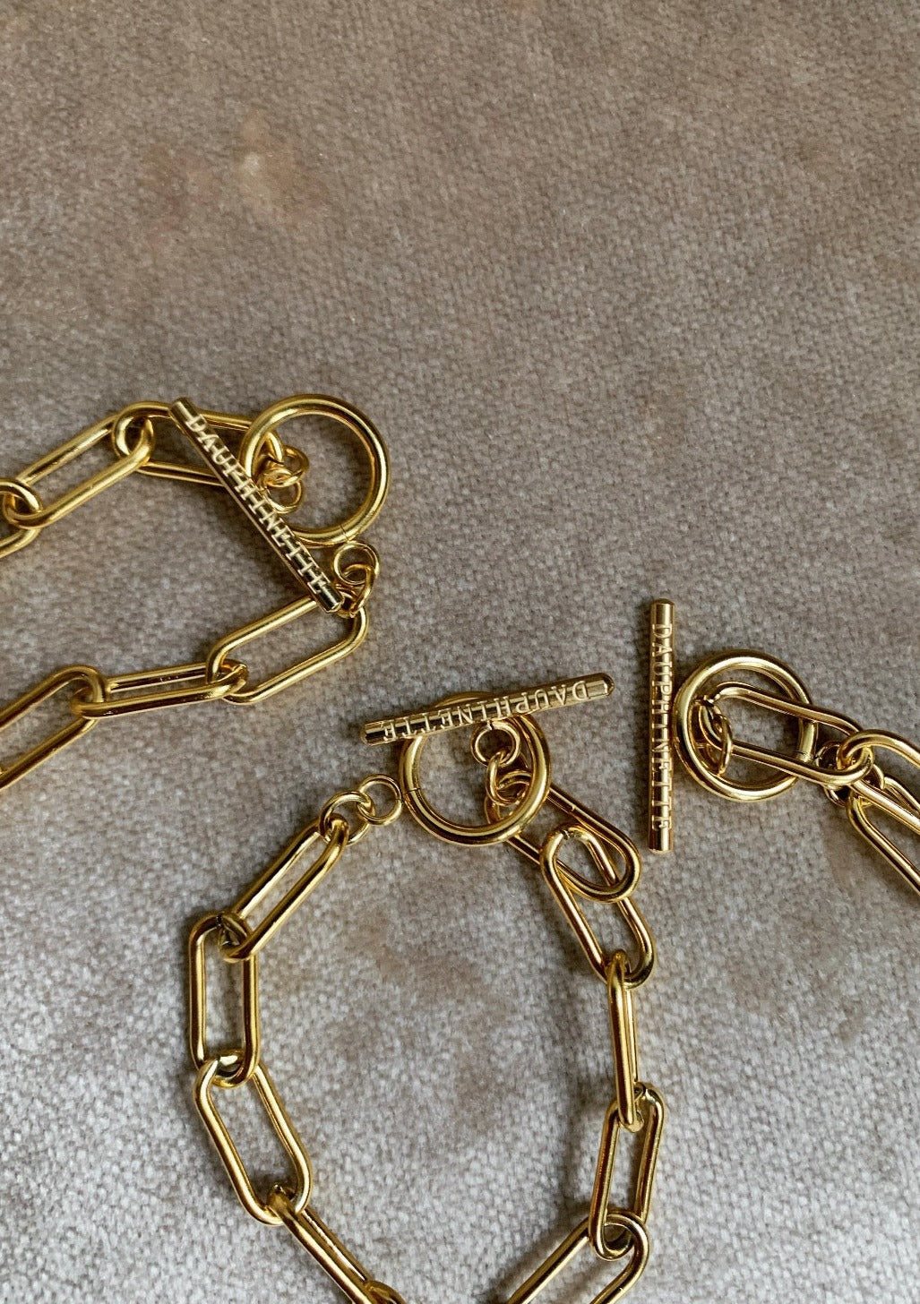 Gold-plated stainless steel Albert chain.