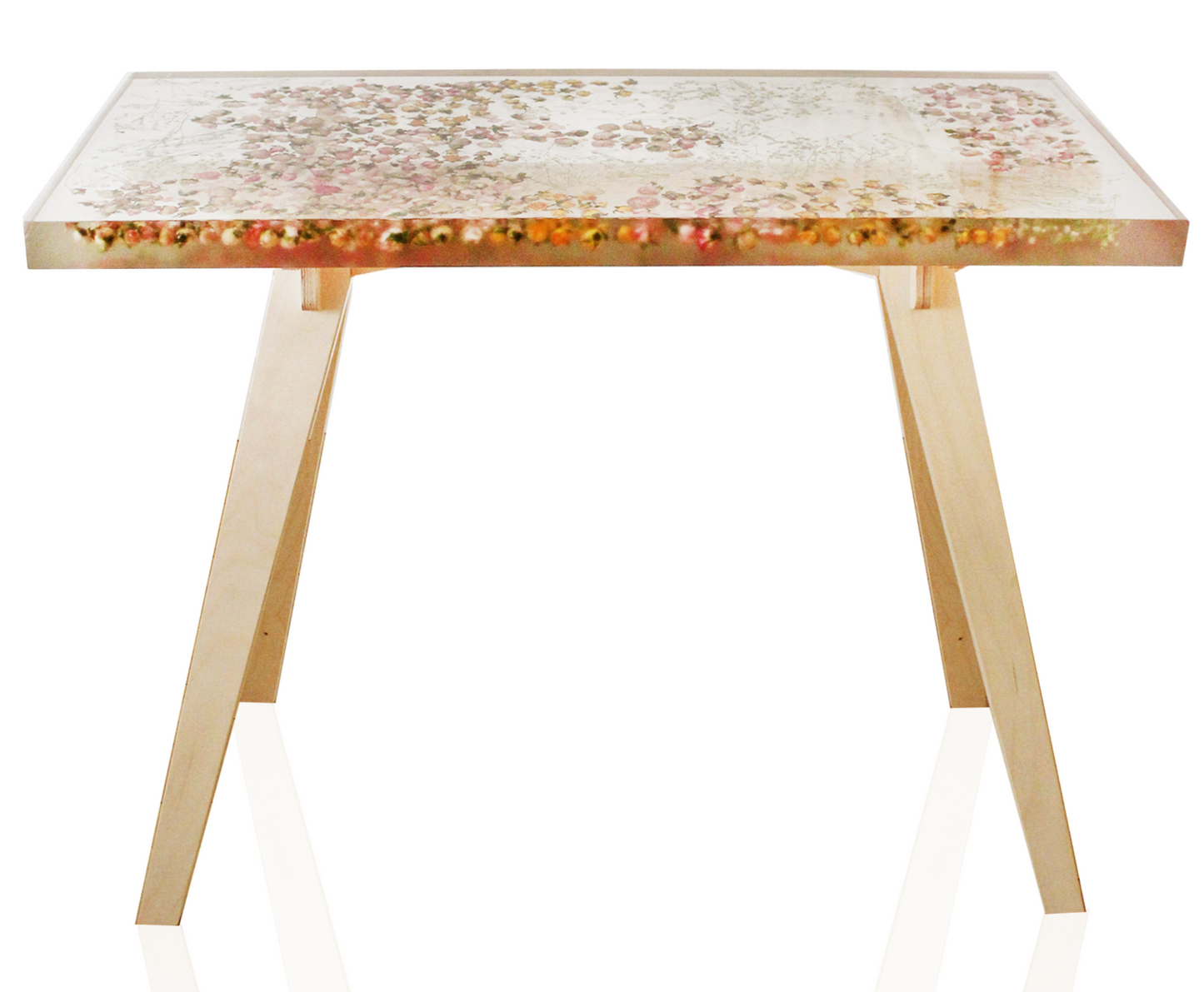 a hand-poured resin desk where hundreds of real rosebuds and baby's breath sprigs float atop a sturdy birch base