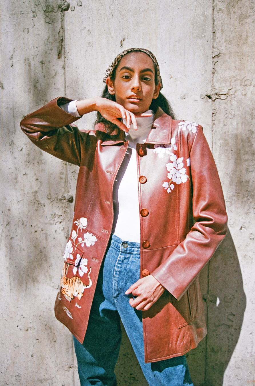 Hand-painted brown leather sportswear jacket from the 1980s. Tiger and floral motifs adapted from Chinese scroll paintings and cabinetry.