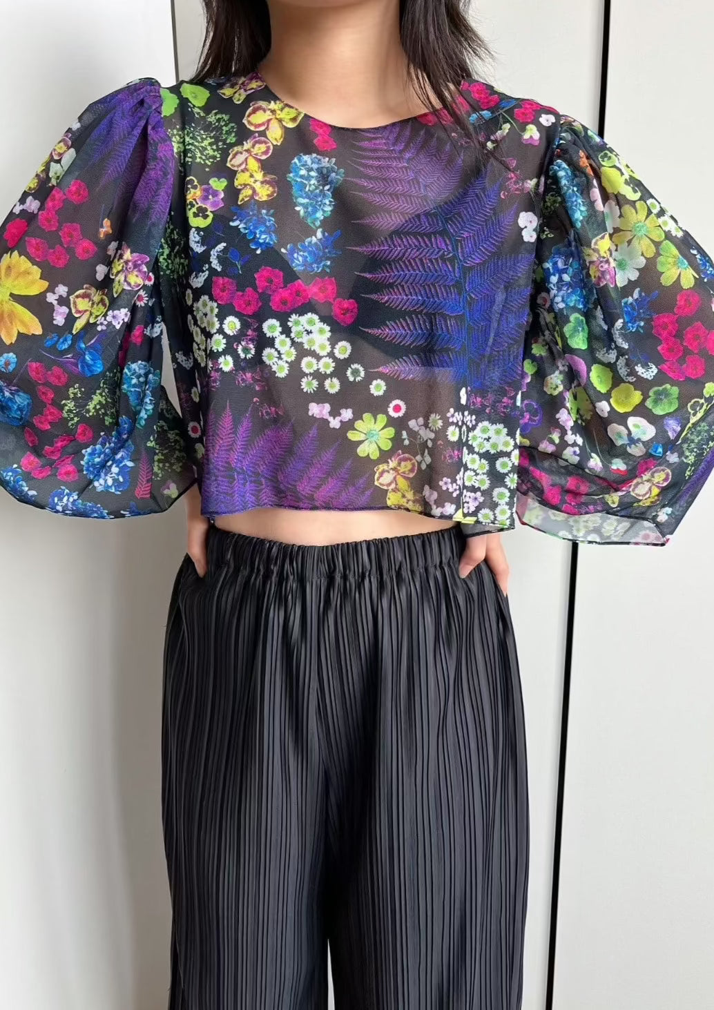 Cropped shirt with bateau neckline and voluminous mid-length bishop sleeves in signature acid potpourri print, comprised of florals scanned and arranged at our NYC studio.
